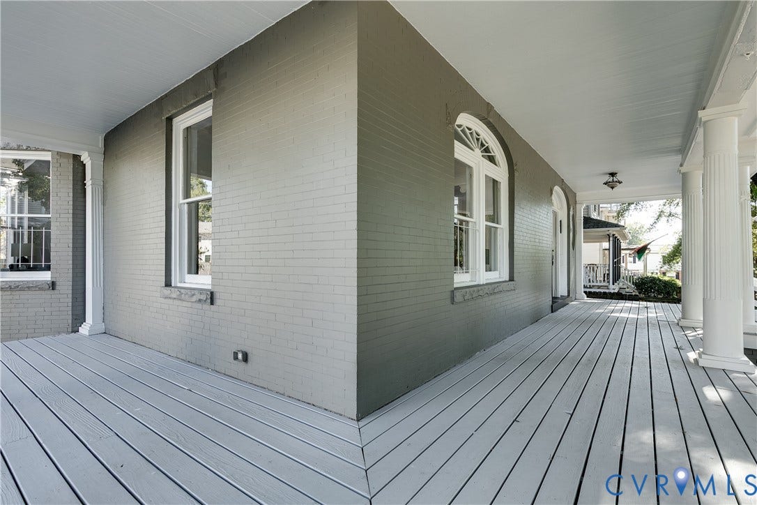 2005 Barton Avenue, Barton Heights, Richmond, VA 23222 Covered porch featuring painted brick exterior, fluted columns, wood-plank decking, and arched window detailing