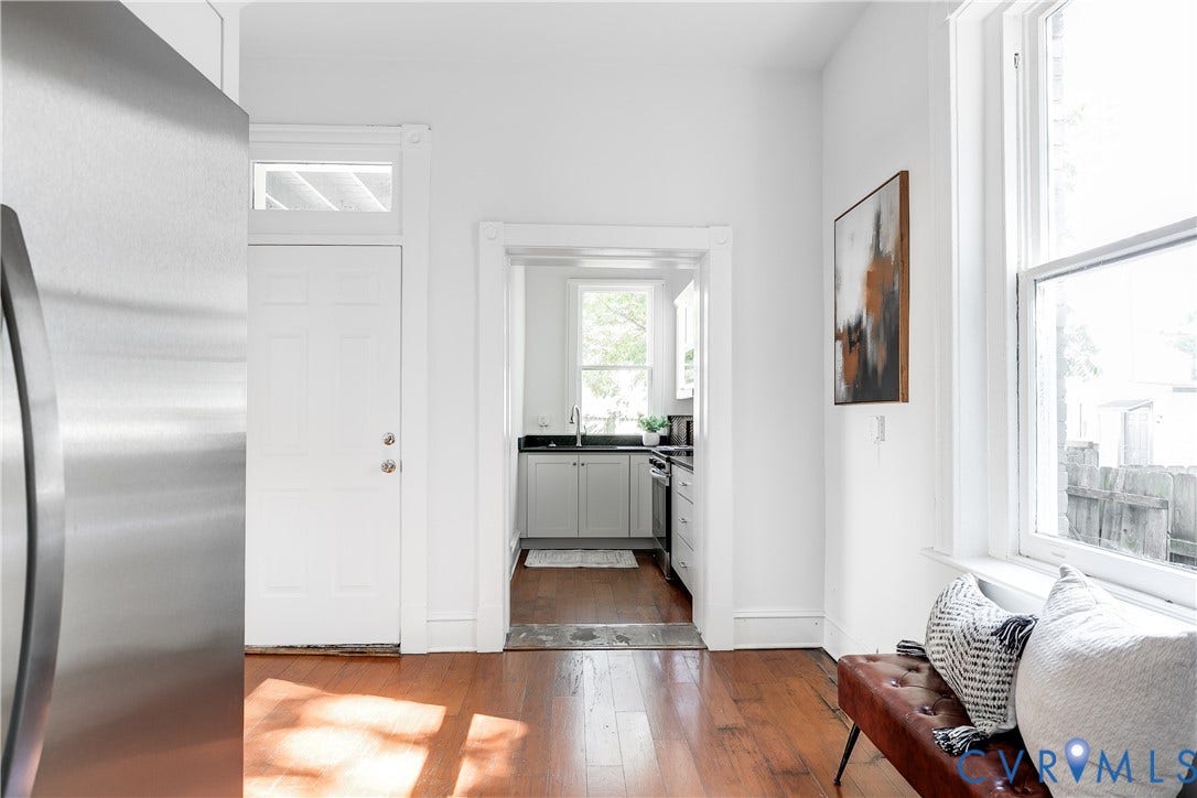 2005 Barton Avenue, Barton Heights, Richmond, VA 23222 Wood-finish flooring, stainless steel refrigerator, white shaker-style cabinetry, and tall multi-pane windows