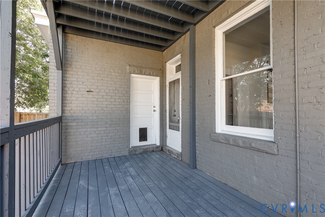 2005 Barton Avenue, Barton Heights, Richmond, VA 23222 Covered porch featuring painted brick exterior walls, wood-plank flooring, and a fenced railing