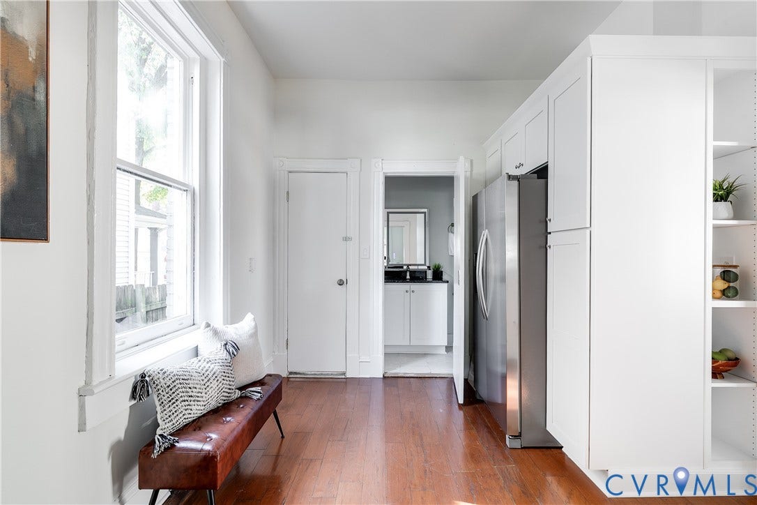 2005 Barton Avenue, Barton Heights, Richmond, VA 23222 Wood-finish flooring, custom white cabinetry, stainless steel refrigerator, and large window with natural light