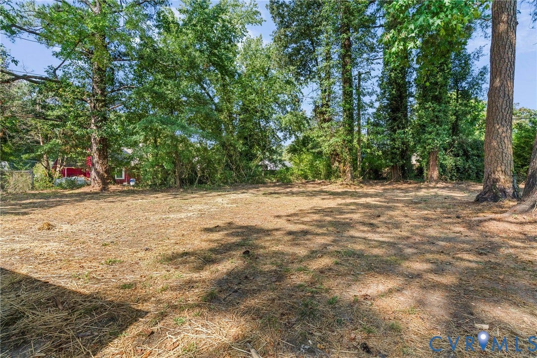 7406 Alycia Avenue, Henrico, VA 23228 Expansive lot featuring mature trees and a cleared, level building area