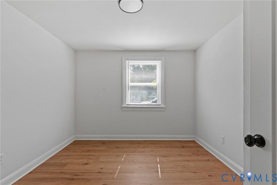 7406 Alycia Avenue, Henrico, VA 23228 Neutral wall tones and wood-finish flooring