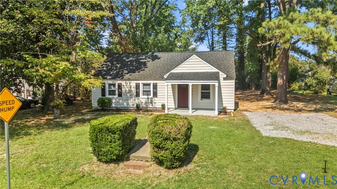 7406 Alycia Avenue, Henrico, VA 23228 Gabled roofline with white siding, red front door, and a covered porch