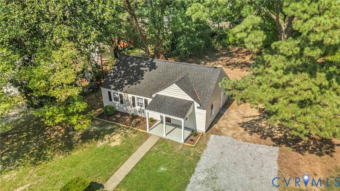 7406 Alycia Avenue, Henrico, VA 23228 Gable roof home with light-toned siding and dark shutters