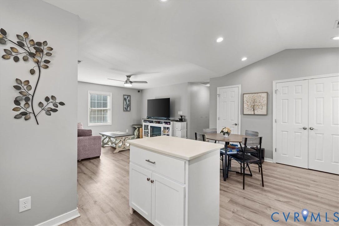 600 Highland Avenue, Hopewell, VA 23860 Vaulted ceilings, wood-finish flooring, recessed lighting, white cabinetry, and double-panel doors