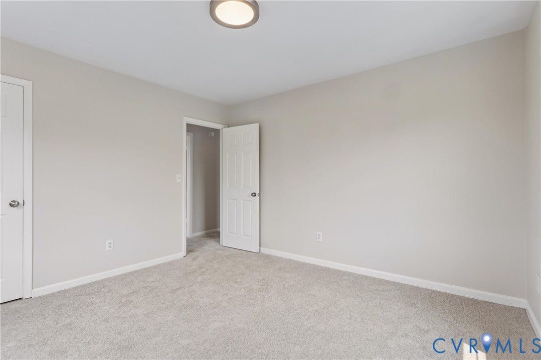 11 Bonita Drive, Hampton, VA 23664 Neutral-toned wall paint, wall-to-wall carpeting, flush-mount circular lighting, and white-paneled interior doors with brushed nickel hardware