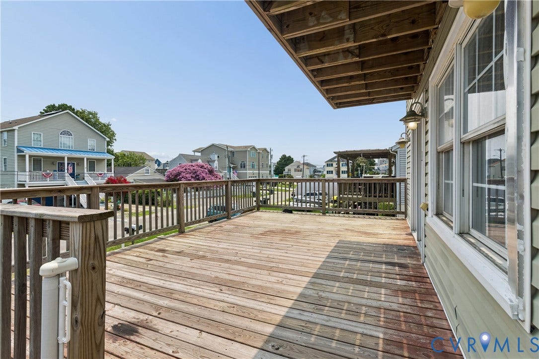 11 Bonita Drive, Hampton, VA 23664 Elevated wood deck featuring a wooden railing and wall-mounted exterior lighting
