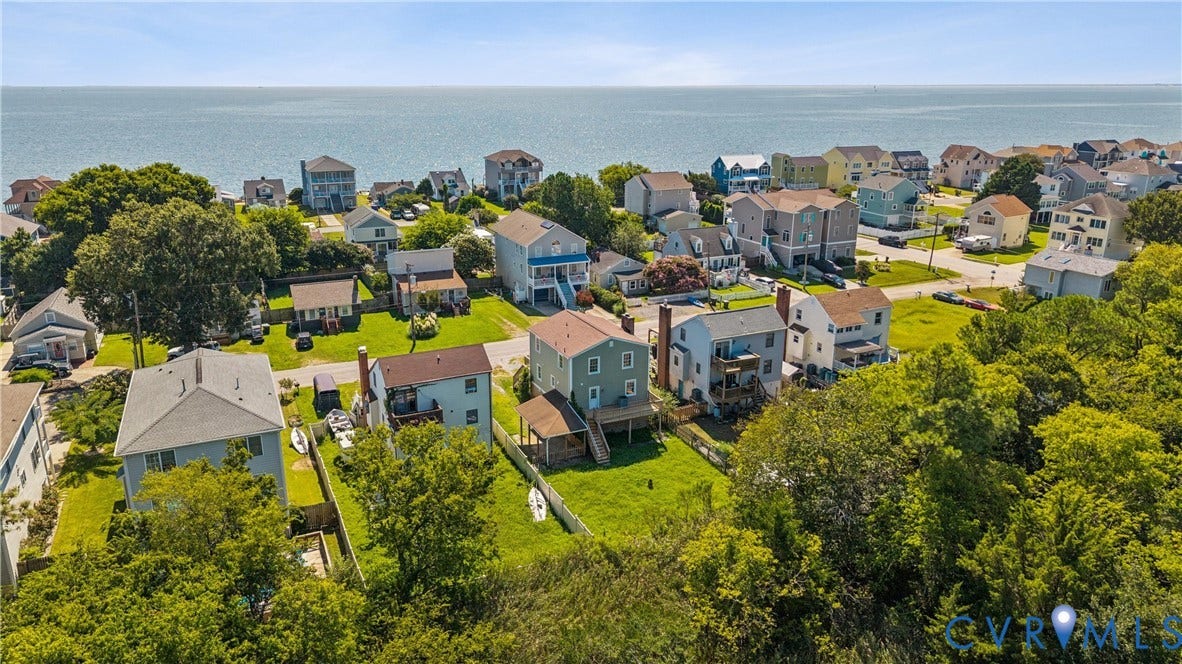 11 Bonita Drive, Hampton, VA 23664 Aerial perspective featuring coastal residential lots, expansive turf lawns, and direct proximity to the open water