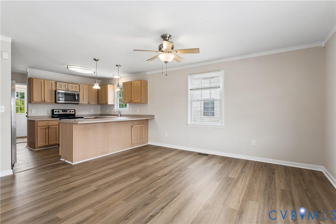 11 Bonita Drive, Hampton, VA 23664 Kitchen featuring wood-finish cabinetry, a peninsula, stainless steel appliances, and wood-finish flooring throughout the space