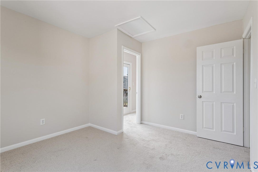 11 Bonita Drive, Hampton, VA 23664 Neutral-toned interior space featuring wall-to-wall carpeting, a six-panel door, and an integrated ceiling access panel