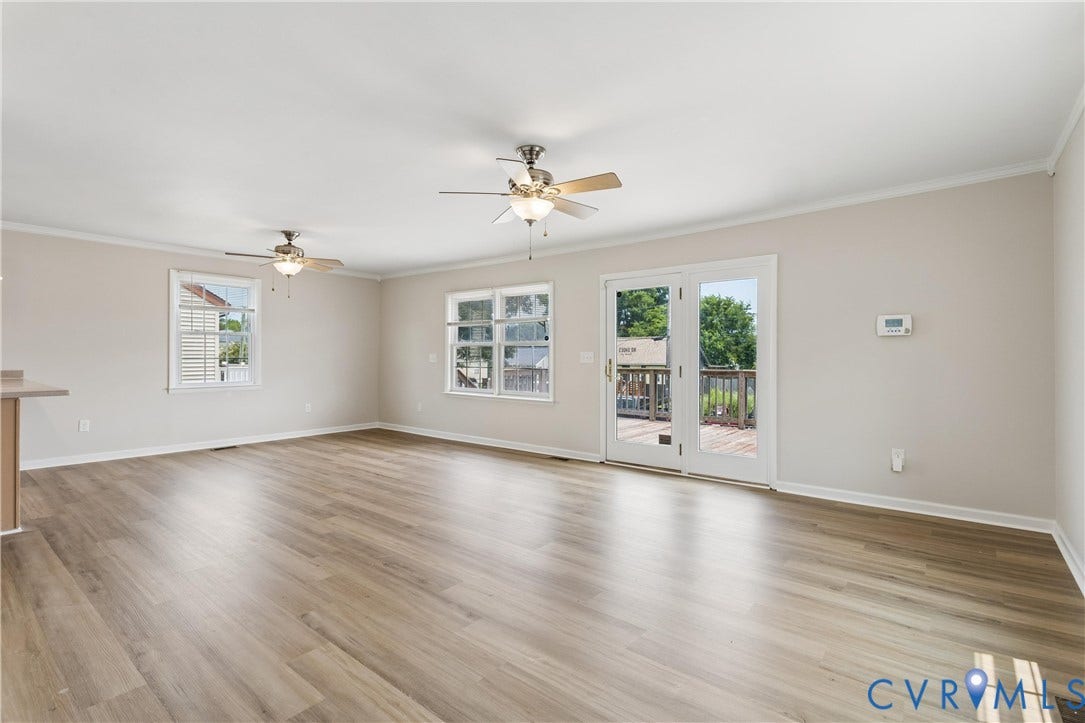 11 Bonita Drive, Hampton, VA 23664 Spacious interior featuring wood-finish flooring, dual ceiling fans, crown molding, and glass-paneled double doors