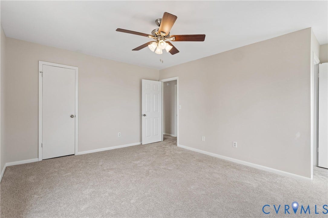 11 Bonita Drive, Hampton, VA 23664 Neutral-toned interior space featuring neutral carpeting, a ceiling-mounted fan with integrated lighting, and multi-panel interior doors