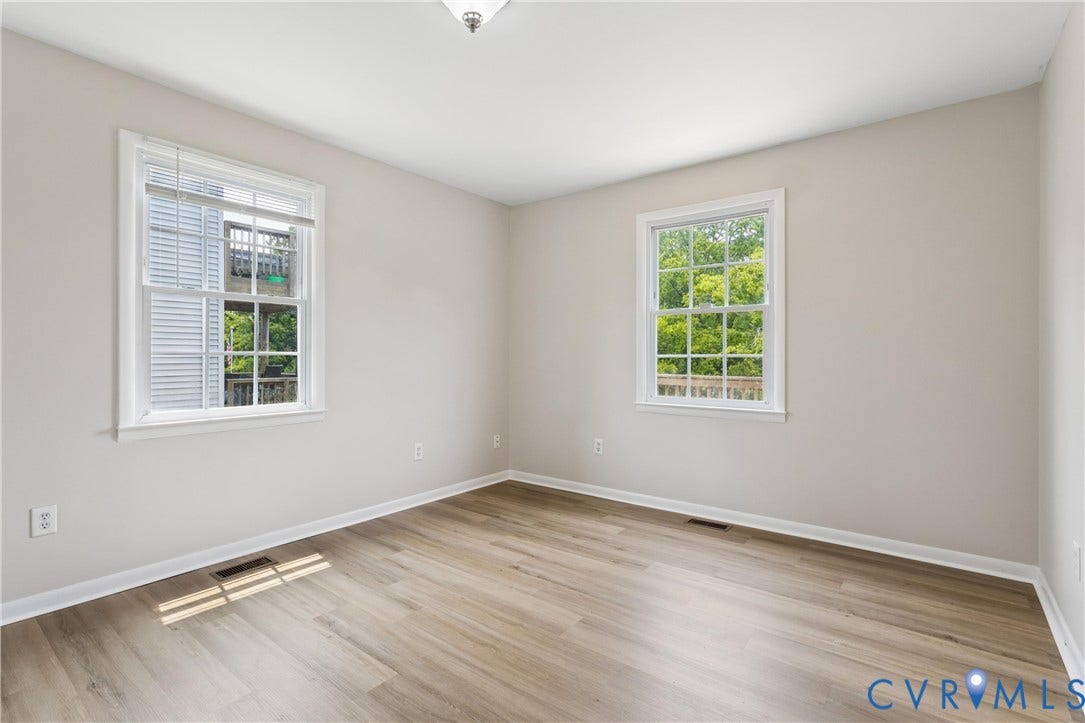 11 Bonita Drive, Hampton, VA 23664 Neutral-toned walls, wood-finish flooring, and two double-hung windows