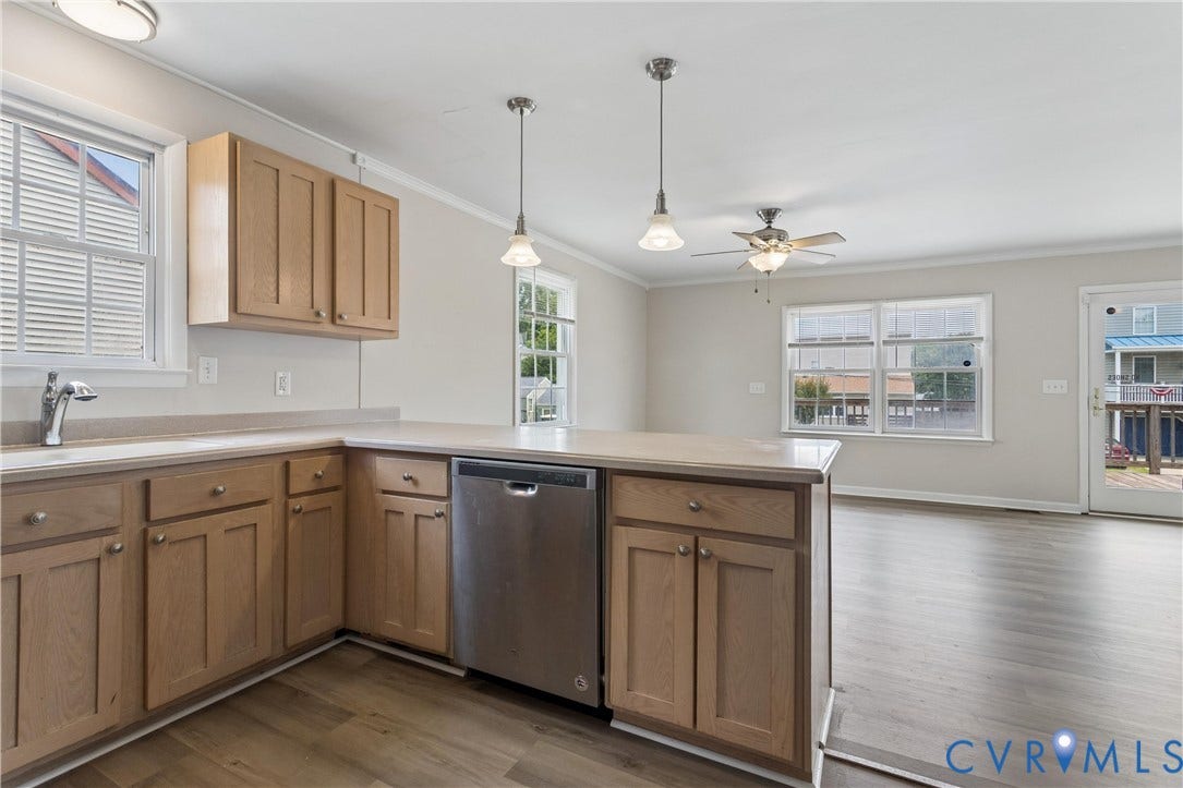 11 Bonita Drive, Hampton, VA 23664 Kitchen featuring wood-finish cabinetry, stainless steel dishwasher, dual pendant lighting, and wood-finish flooring