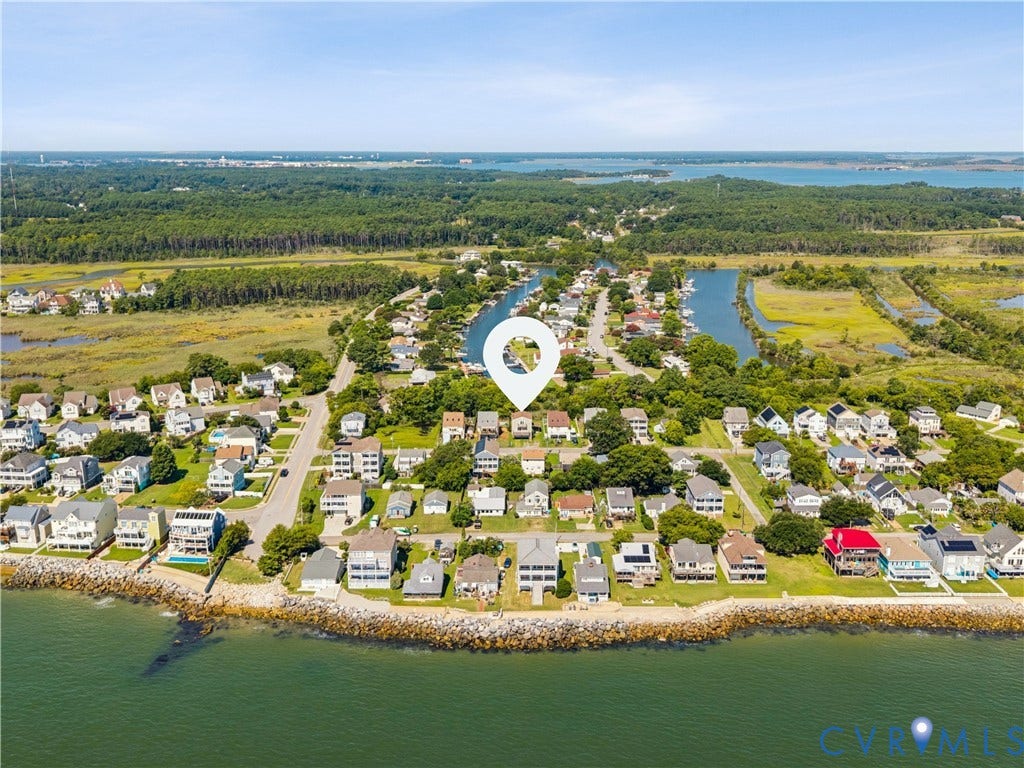 11 Bonita Drive, Hampton, VA 23664 Aerial perspective of coastal residential property featuring waterfront positioning, established tree canopy, and proximity to tidal waterways