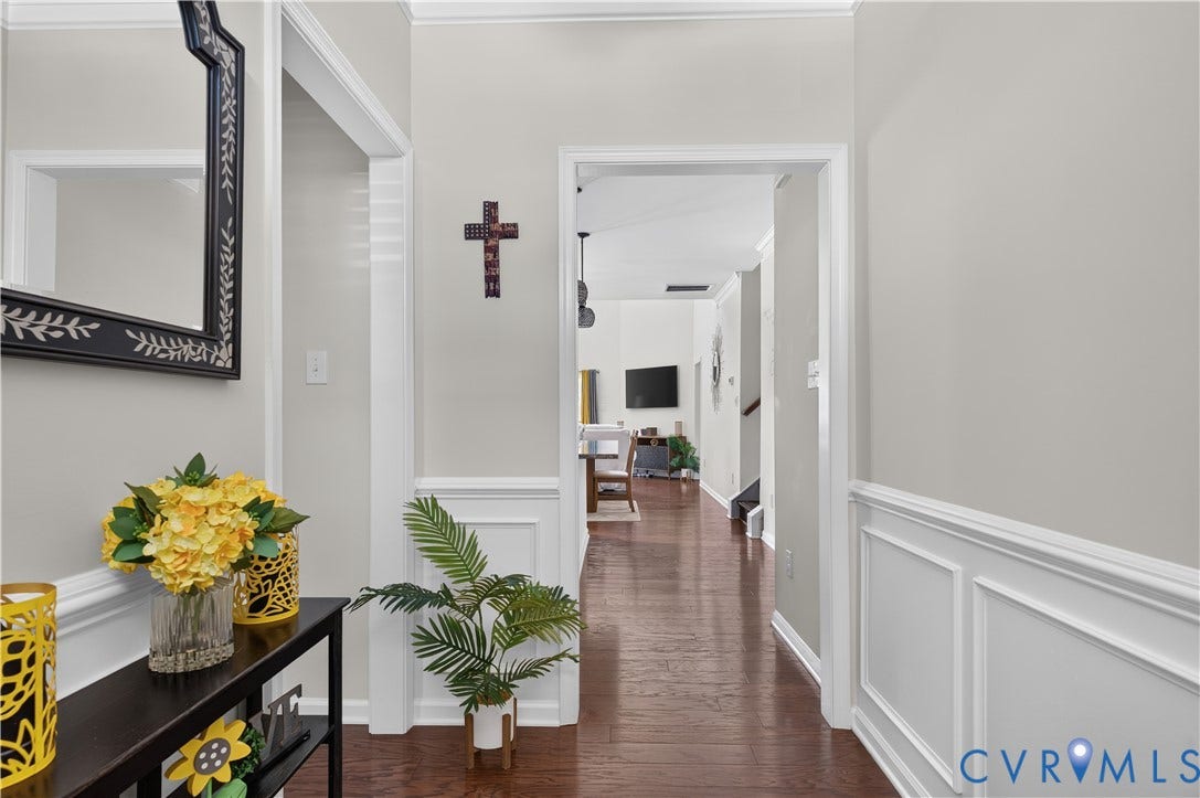 2230 Nightfall Drive, Chesterfield, VA 23236 Foyer featuring wood-finish flooring, white wainscoting, and crisp white door trim