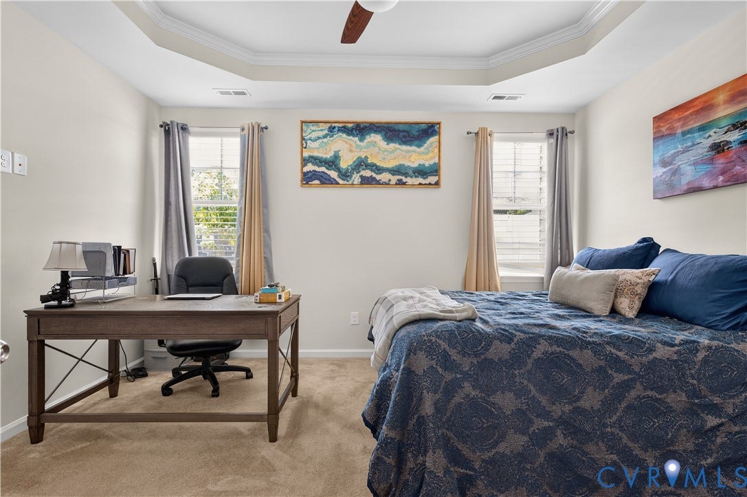 2230 Nightfall Drive, Chesterfield, VA 23236 Room featuring a tray ceiling, ceiling fan, carpeting, and dual windows with window treatments