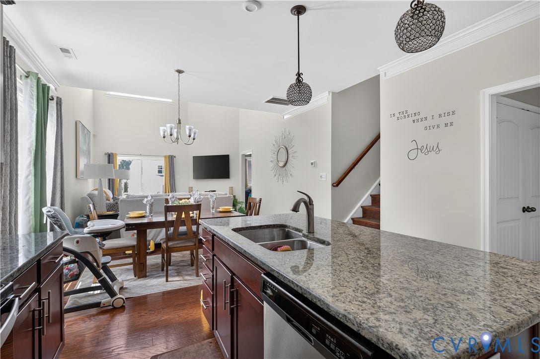 2230 Nightfall Drive, Chesterfield, VA 23236 Kitchen featuring stone countertops, dark wood cabinetry, double-basin stainless steel sink, pendant lighting, and wood-finish flooring