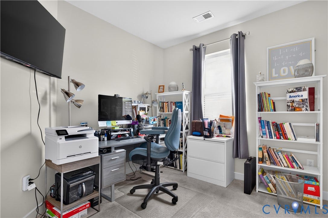 3900 Maze Runner Drive, #102, Chesterfield, VA 23112 Neutral-toned walls, neutral carpeting, and a single-pane window with a curtain rod