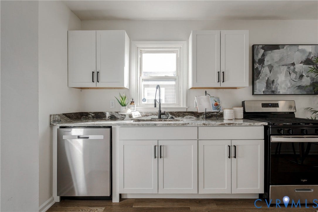 5429 Blueridge Avenue, Fulton, Richmond, VA 23231 Kitchen featuring white shaker-style cabinetry, dark stone countertops, stainless steel dishwasher, high-arc matte black faucet, and wood-finish flooring