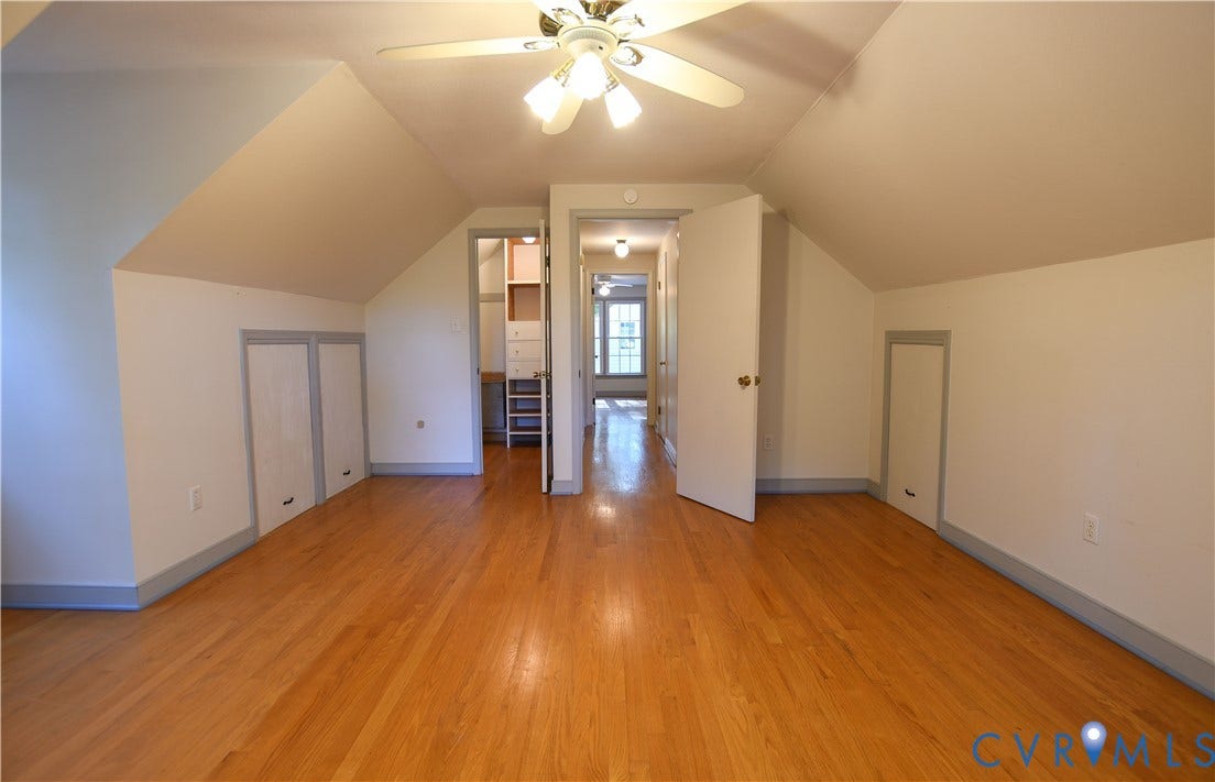3486 Venter Road, Minors Pines, Aylett, VA 23009 Vaulted ceilings featuring wood-finish flooring, built-in knee-wall storage, and a ceiling-mounted light fixture