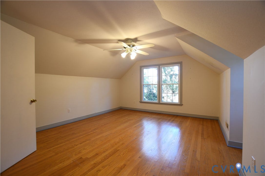 3486 Venter Road, Minors Pines, Aylett, VA 23009 Room featuring wood-finish flooring, vaulted ceilings, dual-pane window with trim, and a multi-light ceiling fan
