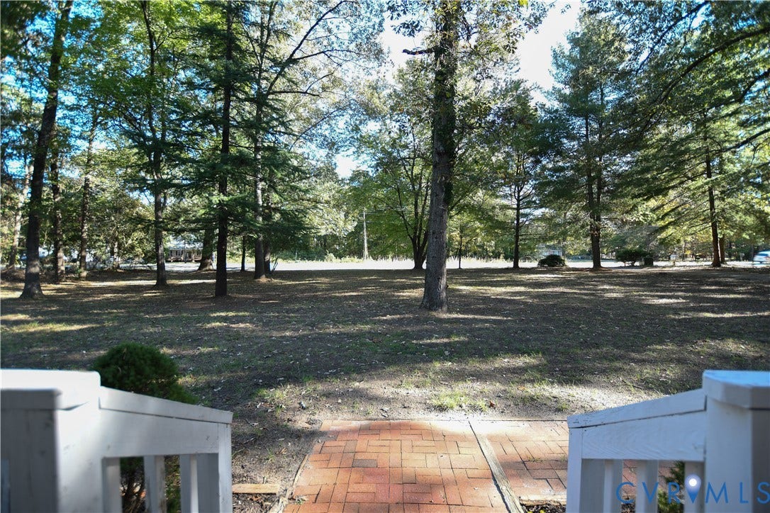 3486 Venter Road, Minors Pines, Aylett, VA 23009 Spacious grounds featuring mature trees and a red brick walkway with white railings