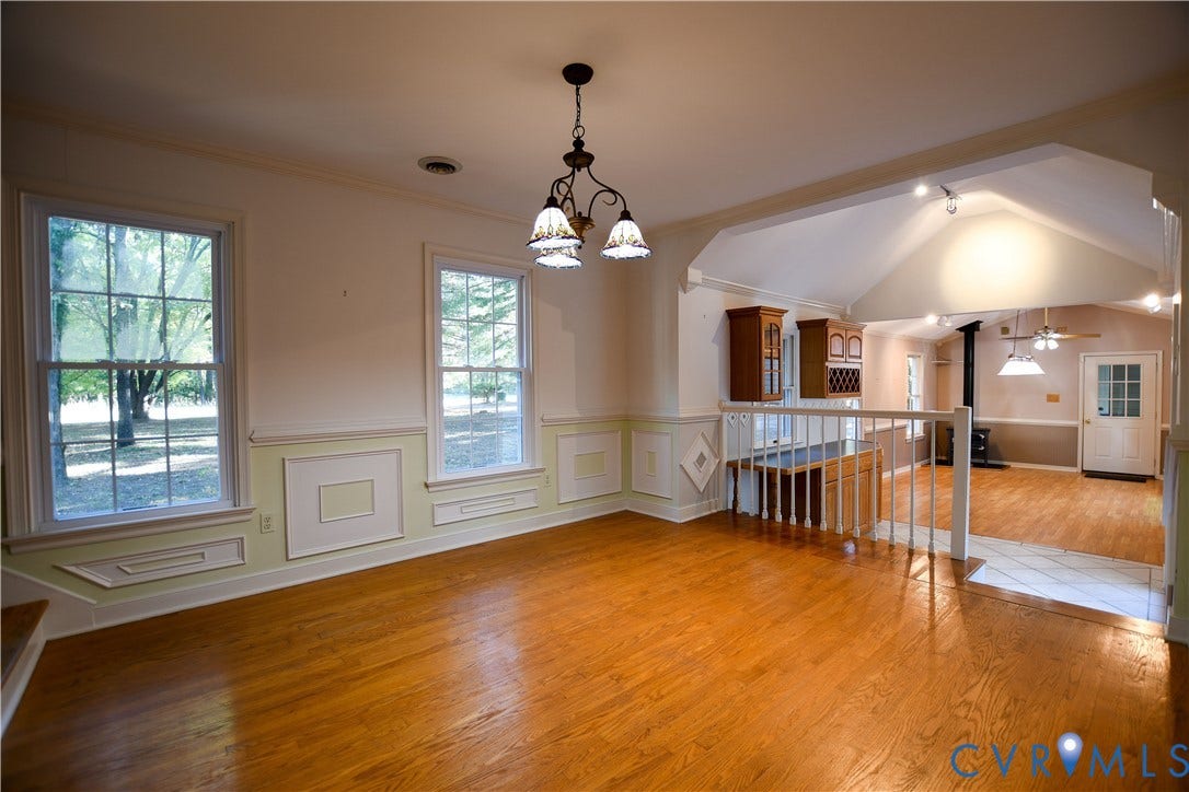 3486 Venter Road, Minors Pines, Aylett, VA 23009 Wood-finish flooring, wainscoting with decorative millwork, multi-pane windows, vaulted ceiling, and built-in cabinetry with glass-front display