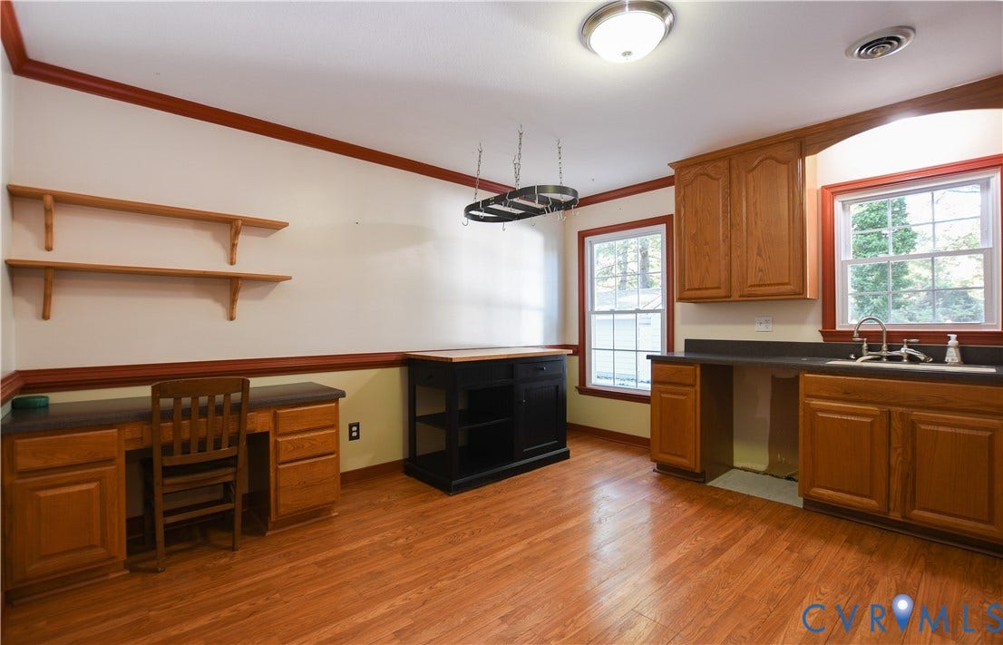 3486 Venter Road, Minors Pines, Aylett, VA 23009 Wood-finish flooring, built-in wooden cabinetry, wall-mounted shelving, dual-window exposure, and integrated workstation