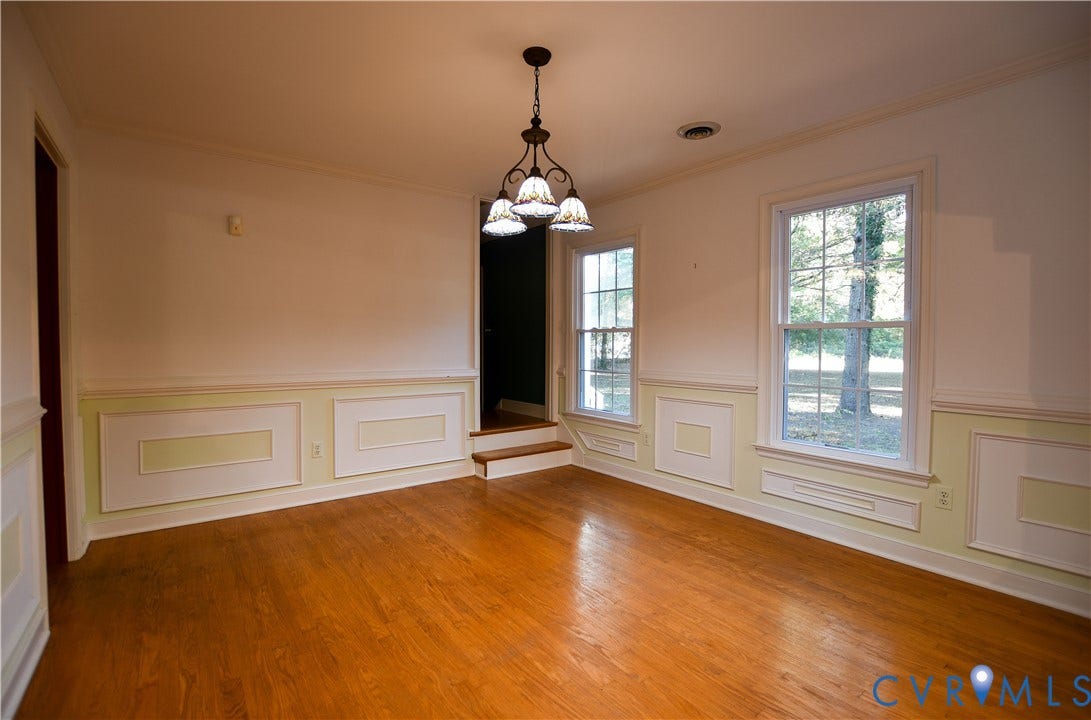 3486 Venter Road, Minors Pines, Aylett, VA 23009 Room featuring wood-finish flooring, wainscoting, multi-pane windows, and a hanging light fixture