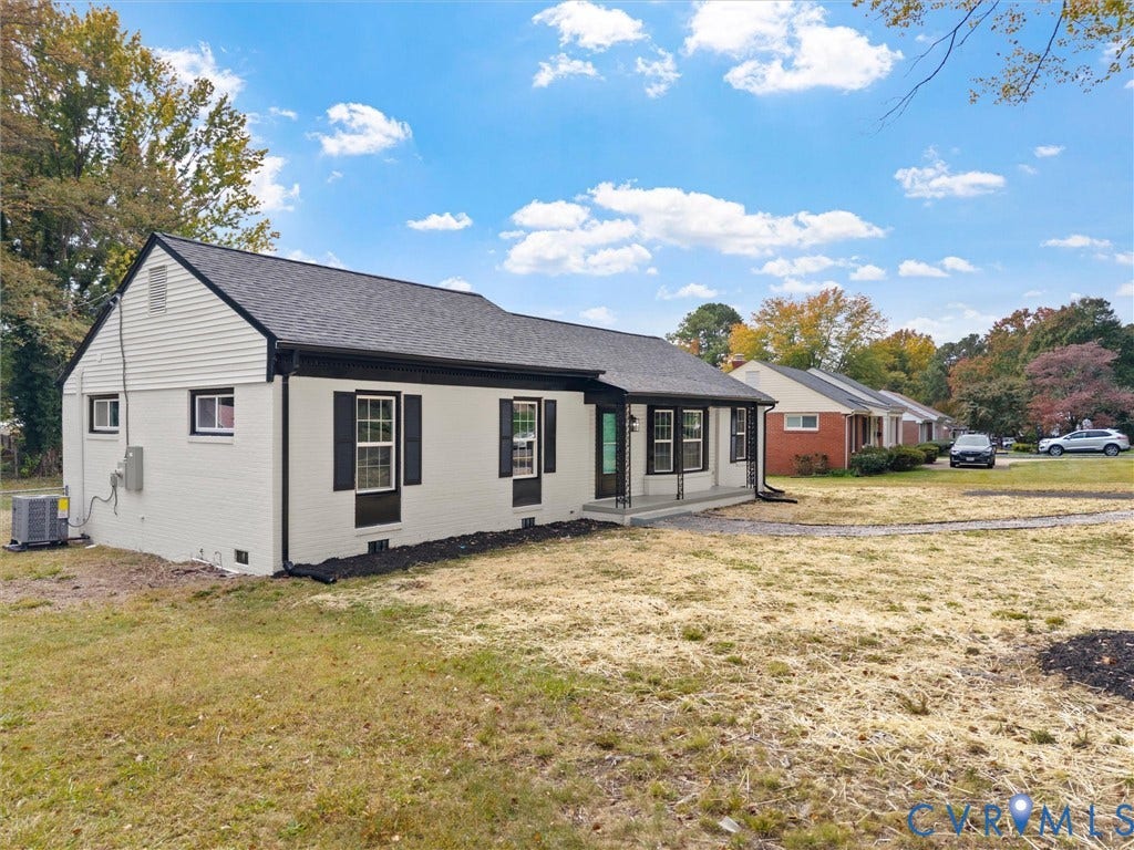 1811 Murdoch Road, Henrico, VA 23229 Painted brick exterior with horizontal siding accents, decorative window shutters, and an asphalt shingle roof