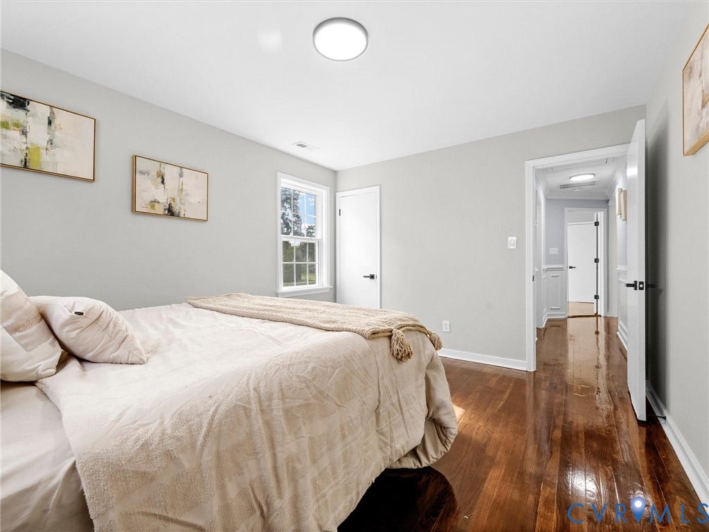 1811 Murdoch Road, Henrico, VA 23229 Wood-finish flooring, neutral wall tones, multi-pane window, and flush-mount lighting