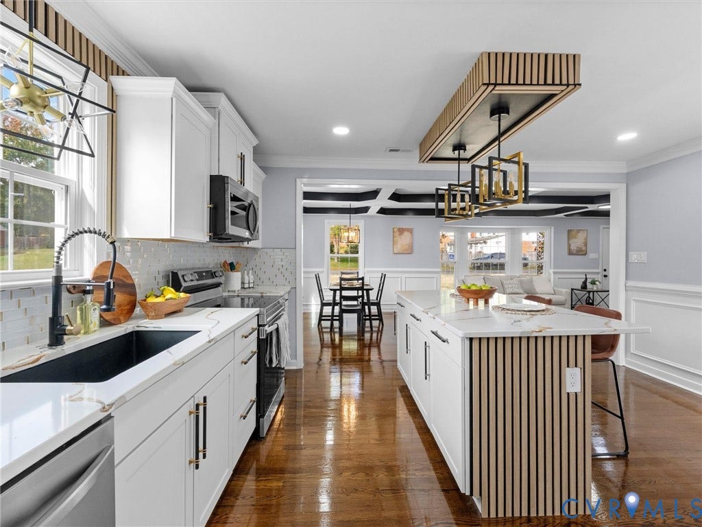 1811 Murdoch Road, Henrico, VA 23229 Kitchen featuring a center island with slatted wood detailing, white cabinetry, stone-finish countertops, geometric pendant lighting, and wood-finish flooring