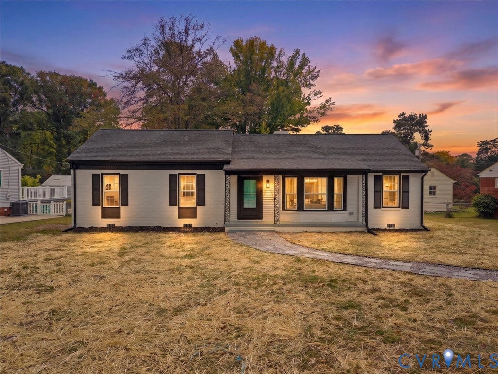 1811 Murdoch Road, Henrico, VA 23229 Single-story exterior featuring a light-toned painted brick facade, dark-finish shutters, a prominent bay window, and a covered front porch entry