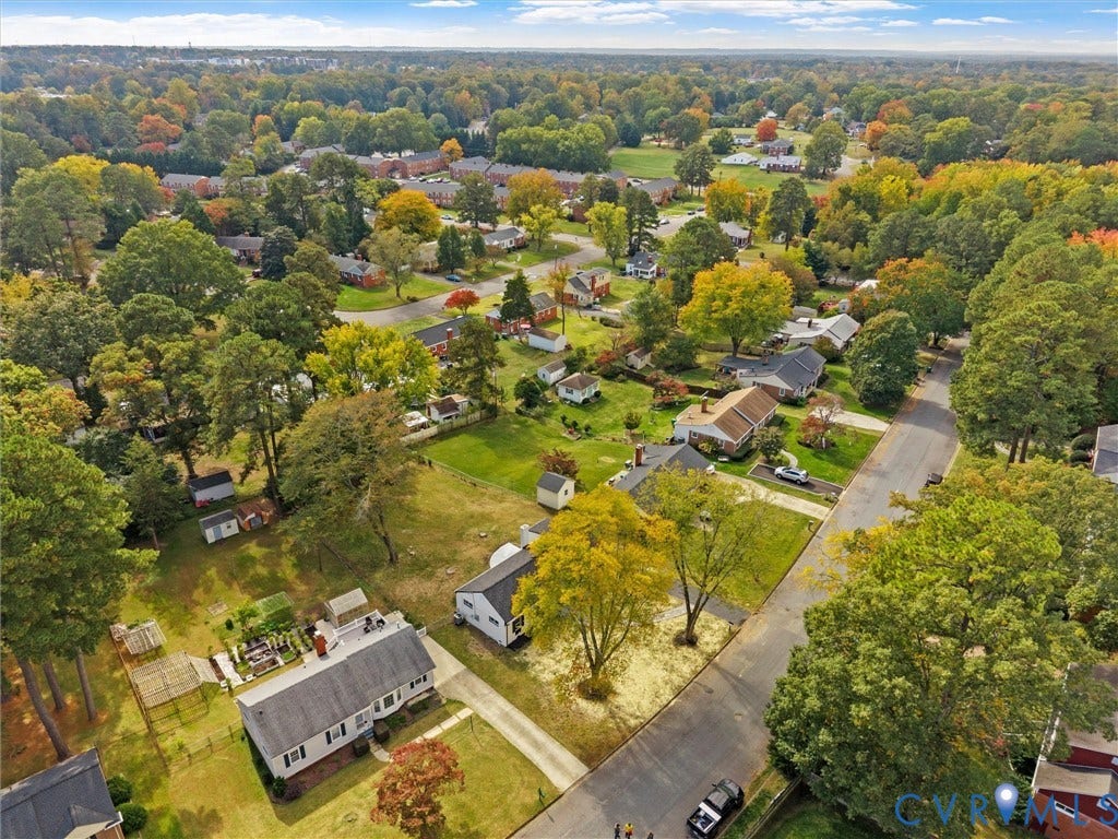 1811 Murdoch Road, Henrico, VA 23229 Aerial perspective showcasing a residential property with a detached storage structure, concrete driveway, and established landscape featuring mature trees on a level lot