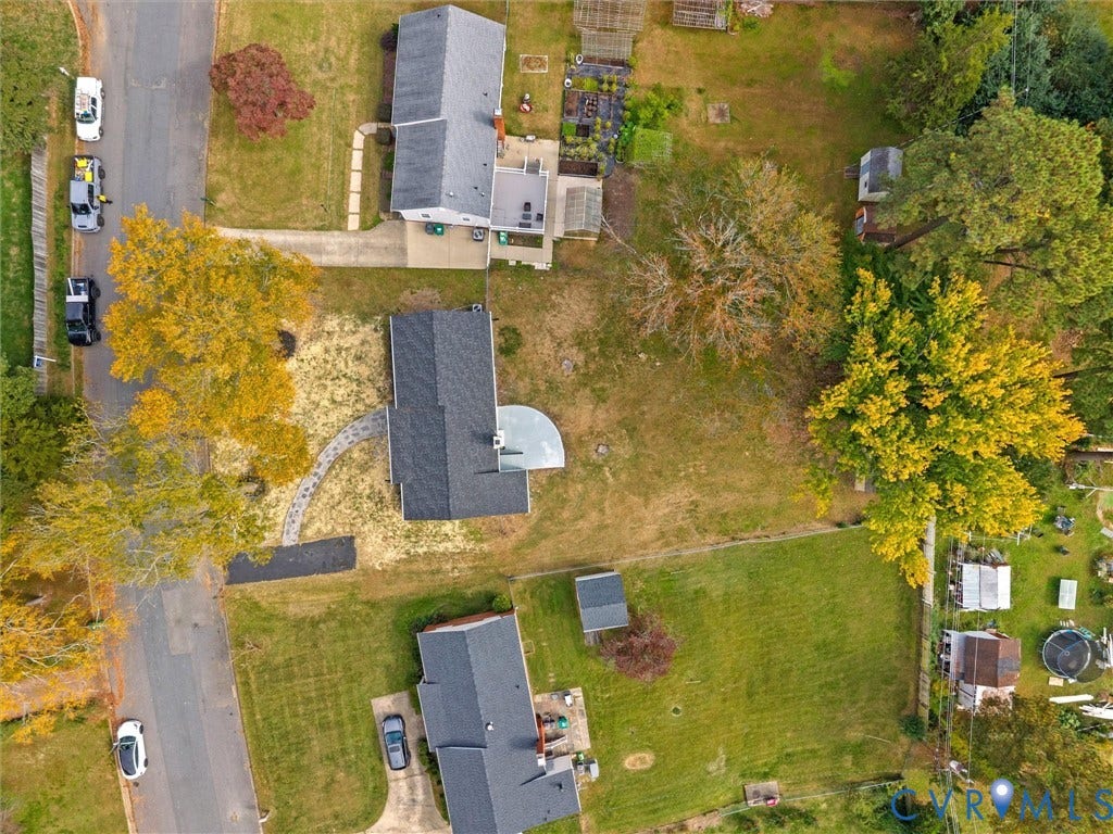 1811 Murdoch Road, Henrico, VA 23229 Aerial perspective of residential lot featuring mature trees, a curved stone paver walkway, and a rear patio