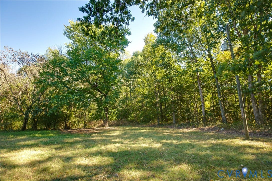 20311 McKenney Highway, Dinwiddie, VA 23882 Expansive lot featuring mature hardwood trees and cleared grass terrain