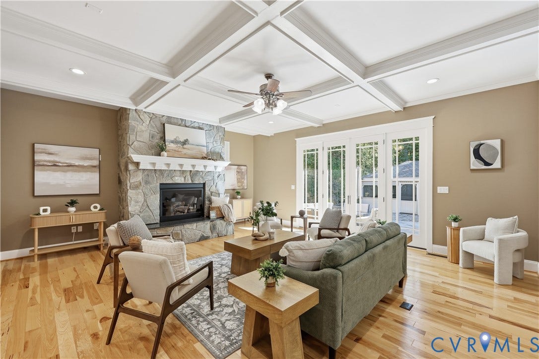 3056 Greywalls Drive, Powhatan, VA 23139 Coffered ceilings, stone-surround fireplace with a wooden mantel, hardwood flooring, and multi-pane glass doors