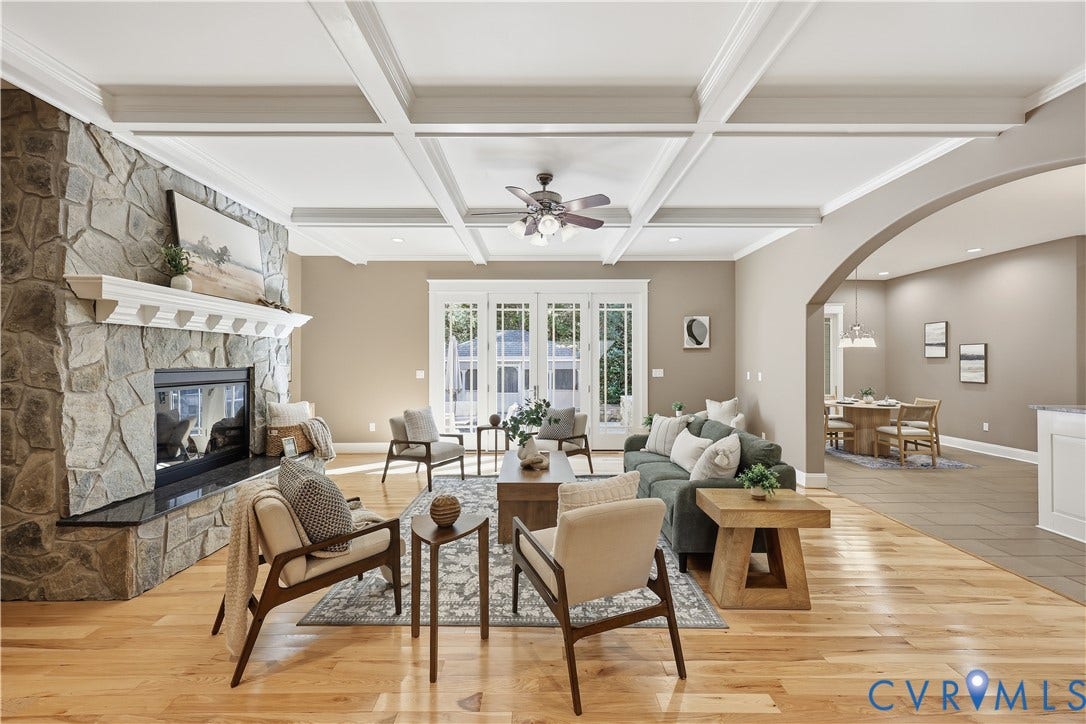 3056 Greywalls Drive, Powhatan, VA 23139 Coffered ceiling, floor-to-ceiling stone-veneer fireplace, wood-finish flooring, glass-paned double doors, and arched entryway