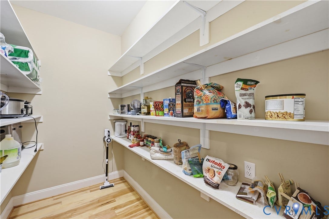 3056 Greywalls Drive, Powhatan, VA 23139 Walk-in storage space featuring multi-level white shelving and wood-finish flooring