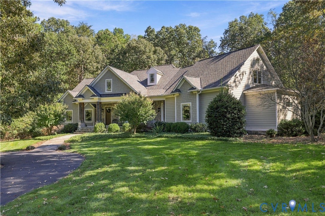 3056 Greywalls Drive, Powhatan, VA 23139 Multi-gabled exterior featuring horizontal lap siding, stone accent pillars, a covered entryway, and asphalt shingle roofing