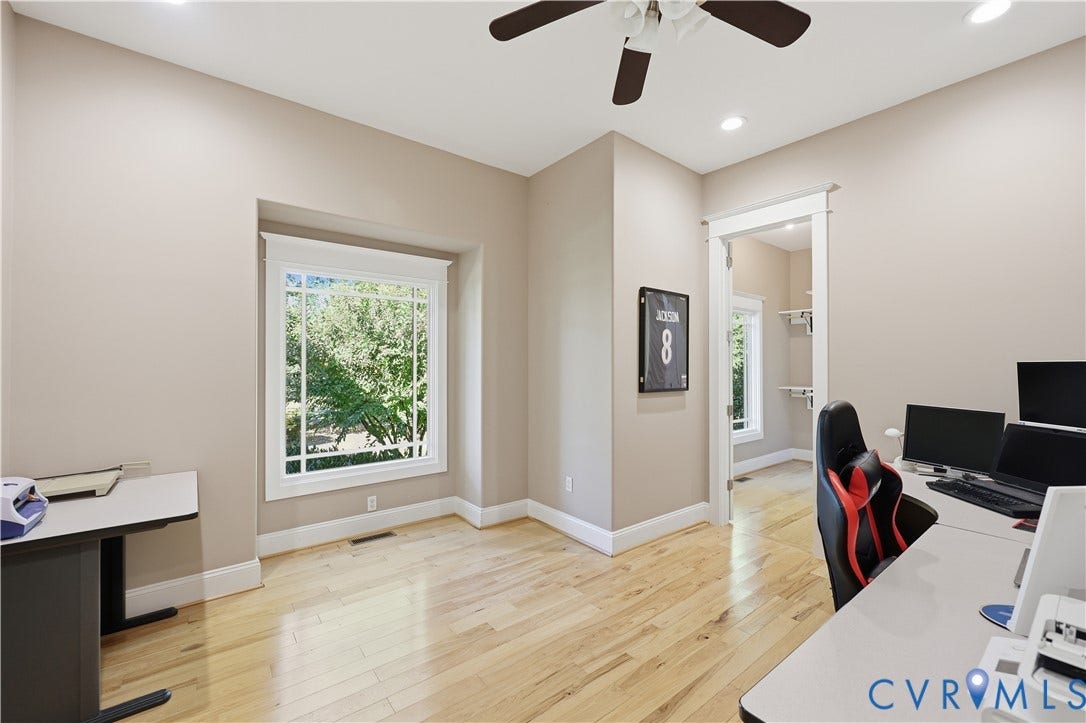 3056 Greywalls Drive, Powhatan, VA 23139 Wood-finish flooring, recessed lighting, ceiling fan, and large multi-pane window with substantial trim