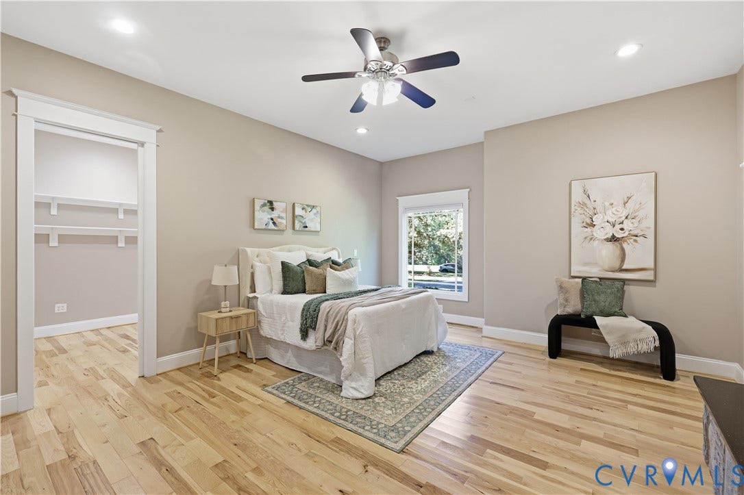 3056 Greywalls Drive, Powhatan, VA 23139 Spacious room featuring wood-finish flooring, recessed lighting, a ceiling fan with integrated light fixture, window with wide casing, and built-in closet shelving