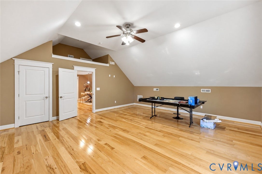 3056 Greywalls Drive, Powhatan, VA 23139 Vaulted ceilings, wood-finish flooring, recessed lighting, and a multi-blade ceiling fan