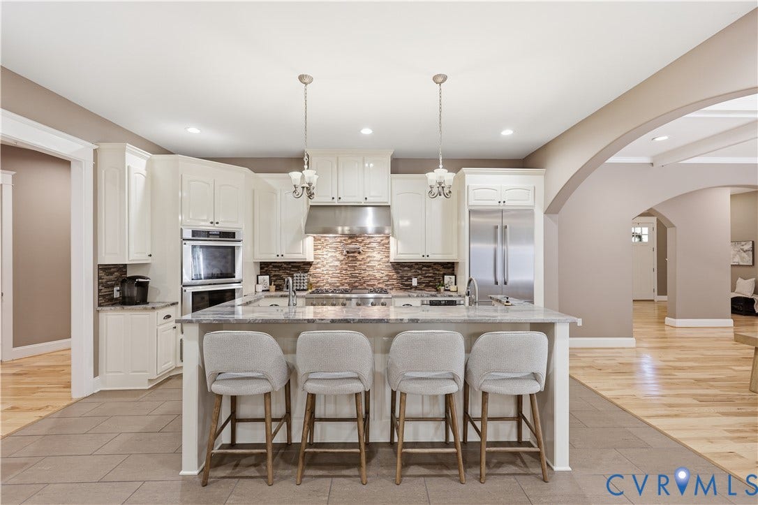 3056 Greywalls Drive, Powhatan, VA 23139 Kitchen featuring white cabinetry, stone-finish countertops, stainless steel appliances, stone tile backsplash, and wood-finish flooring