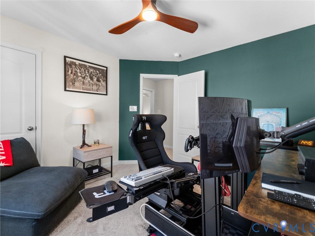 5726 Gossamer Place, Wynwood At FoxCreek, Moseley, VA 23120 Three-blade wood-finish ceiling fan with integrated lighting, neutral wall-to-wall carpeting, and an accent wall painted in a deep forest green