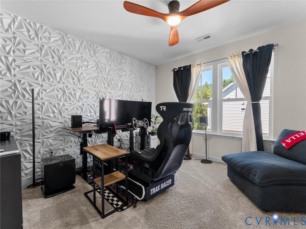 5726 Gossamer Place, Wynwood At FoxCreek, Moseley, VA 23120 Textured three-dimensional accent wall, large windows with natural light, and contemporary wood-finish ceiling fan