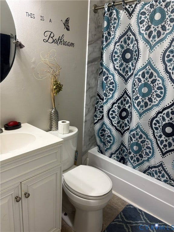 3207 Roland View Terrace, Chester, VA 23831 Bathroom featuring a white vanity cabinet with an integrated basin, a standard-height toilet, and a tub-shower combination with surround tile