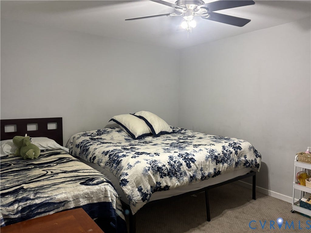 3207 Roland View Terrace, Chester, VA 23831 Neutral-toned interior space featuring a ceiling fan with integrated light fixture and wall-to-wall carpeting