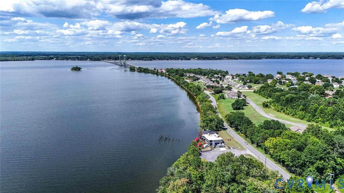 700 Jordan Point Road, North Prince George, VA 23860 Aerial perspective of waterfront property featuring extensive shoreline frontage, direct water access, and surrounding mature woodland